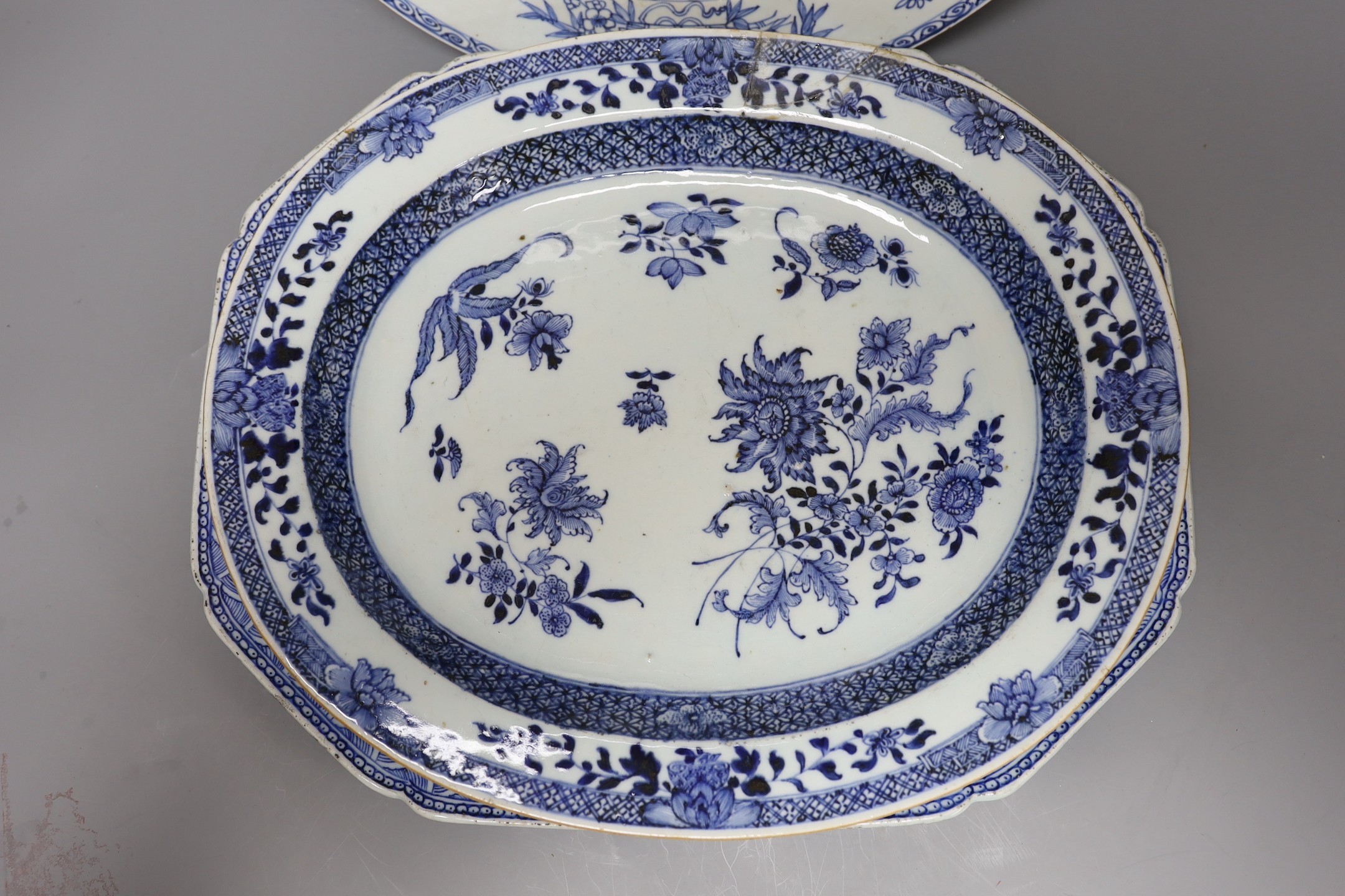 Three Chinese export blue and white dishes, 18th/19th century, largest 42 cms wide